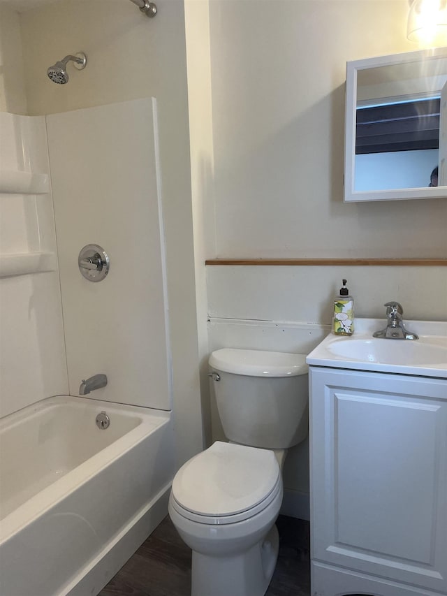 full bathroom featuring toilet,  shower combination, wood-type flooring, and vanity