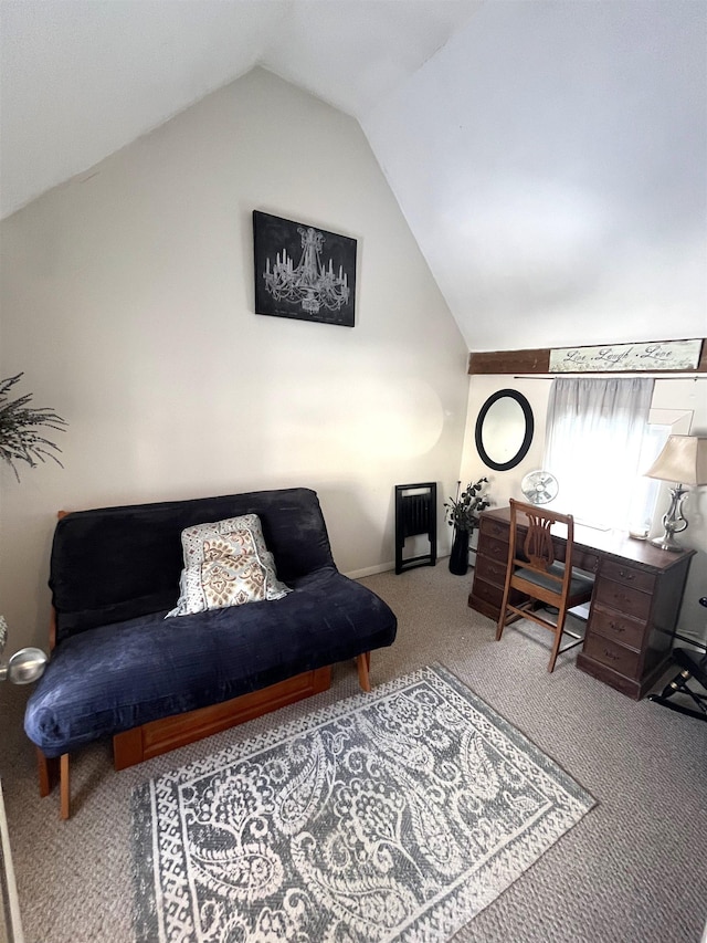 carpeted home office featuring vaulted ceiling