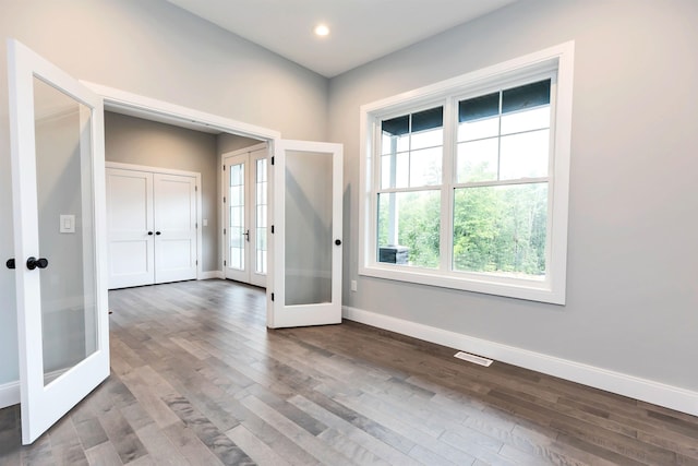 entryway with hardwood / wood-style floors and french doors