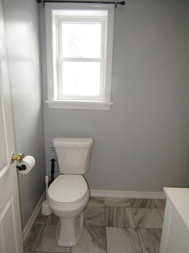 bathroom with toilet and vanity