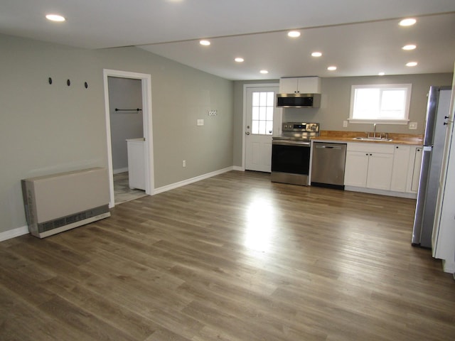 kitchen featuring sink, white cabinetry, appliances with stainless steel finishes, and a healthy amount of sunlight