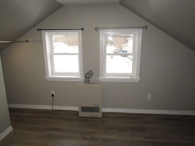 additional living space with lofted ceiling and dark wood-type flooring