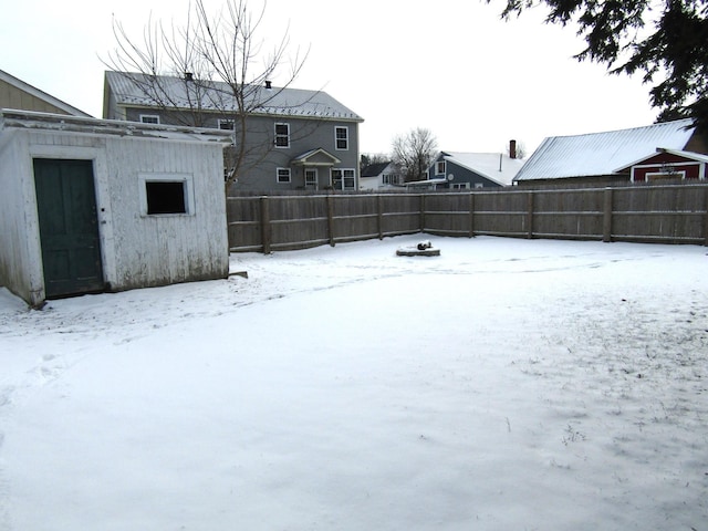 view of yard layered in snow