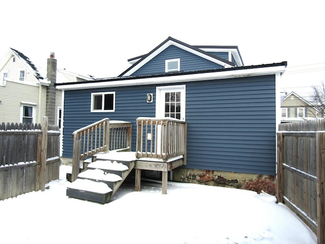 view of snow covered house