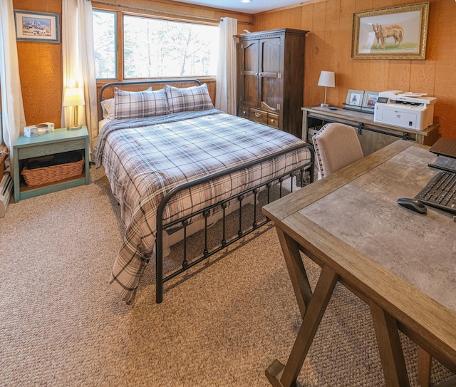 bedroom featuring wood walls and carpet floors