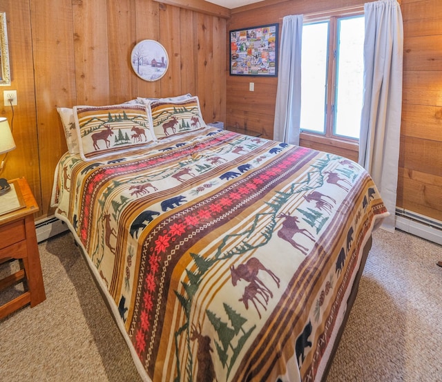 carpeted bedroom with wood walls and a baseboard radiator