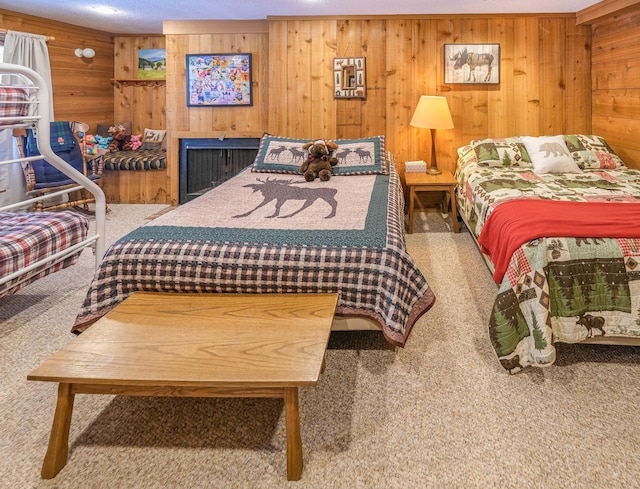 bedroom featuring carpet and wooden walls