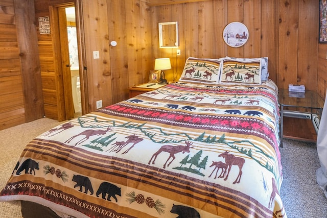 carpeted bedroom featuring wooden walls