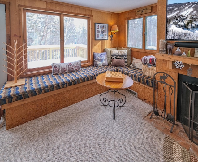 living room featuring wood walls