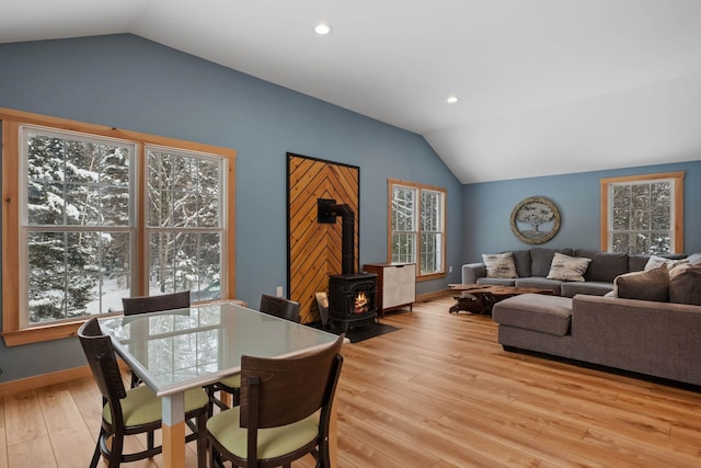 dining space featuring lofted ceiling, light wood finished floors, baseboards, and recessed lighting