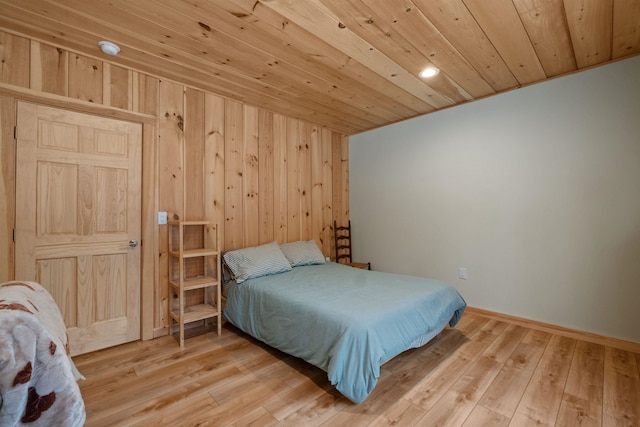 bedroom with hardwood / wood-style floors and wood ceiling