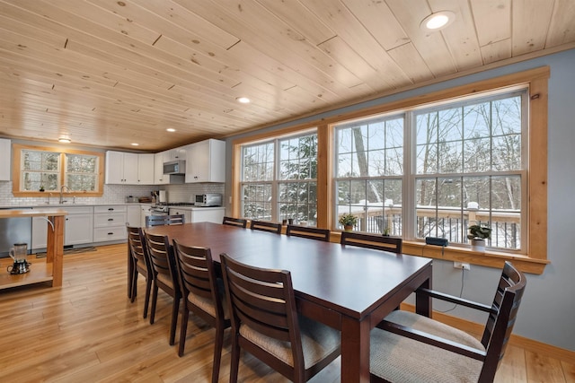 dining room with light wood-type flooring, wooden ceiling, and recessed lighting