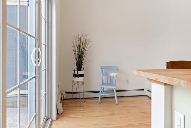 interior space featuring hardwood / wood-style floors and a baseboard radiator