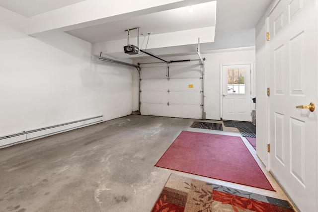 garage featuring baseboard heating and a garage door opener