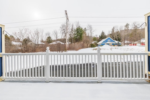 view of snow covered gate