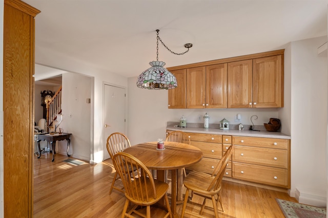 dining space featuring light hardwood / wood-style floors