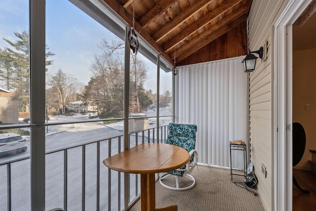 sunroom / solarium with lofted ceiling with beams and wooden ceiling