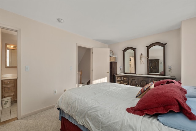 carpeted bedroom with ensuite bath