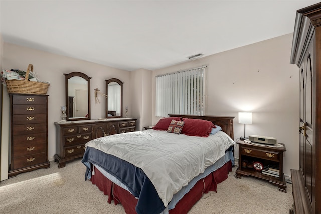 bedroom with light colored carpet