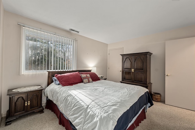 bedroom with light colored carpet