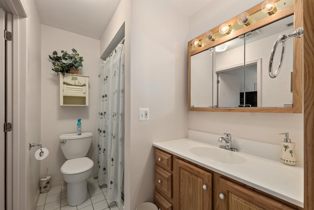 bathroom with toilet, vanity, walk in shower, and tile patterned flooring