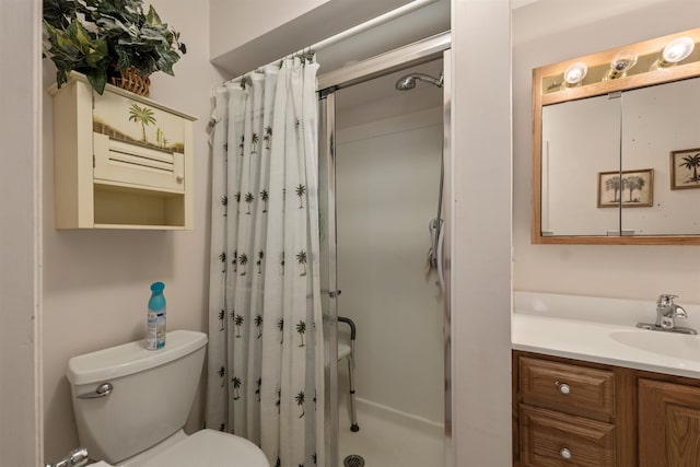 bathroom with toilet, vanity, and a shower with curtain