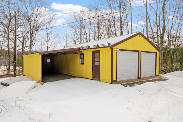 view of snow covered garage