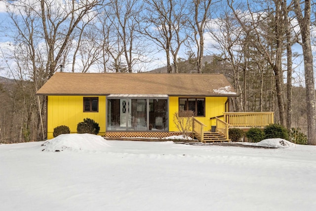 single story home featuring a deck