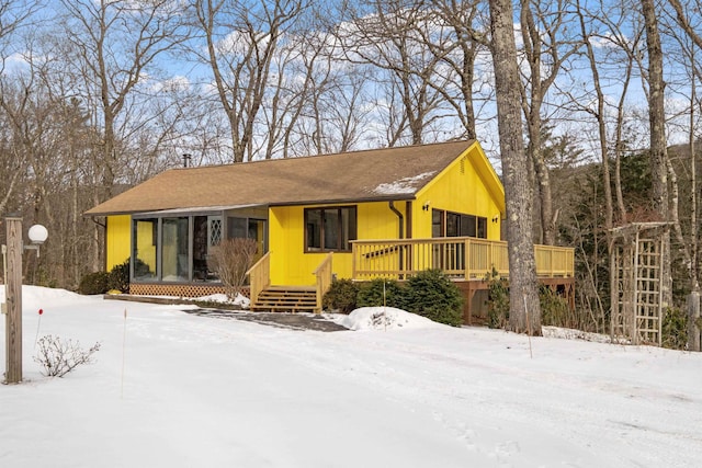 single story home featuring a wooden deck