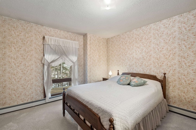 bedroom with light colored carpet, baseboard heating, and a textured ceiling