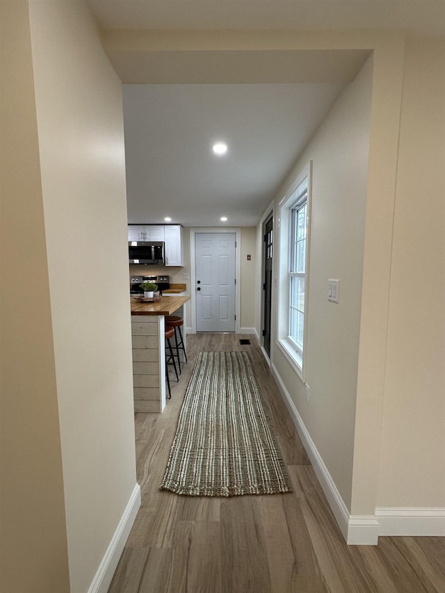 hallway featuring light hardwood / wood-style floors