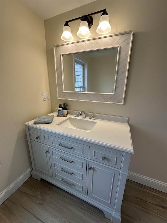 bathroom featuring wood-type flooring and vanity