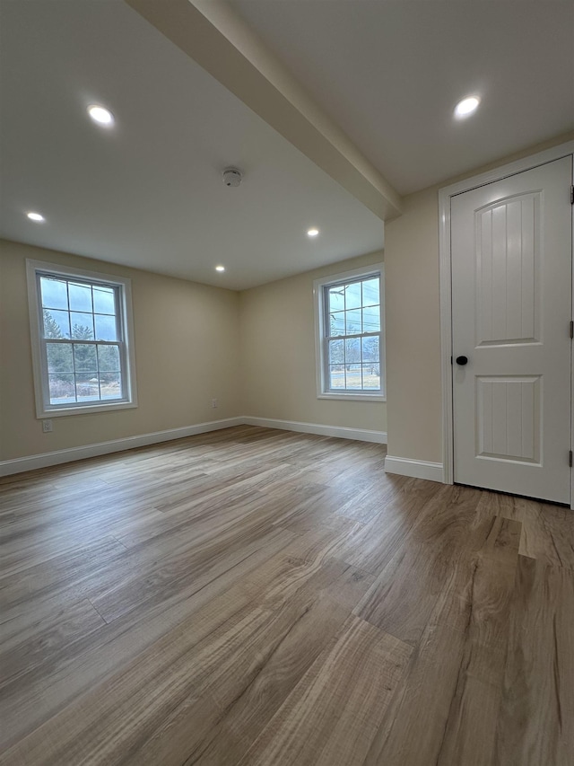 spare room with light hardwood / wood-style flooring