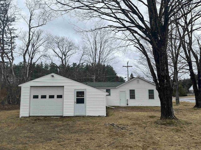 garage with a yard