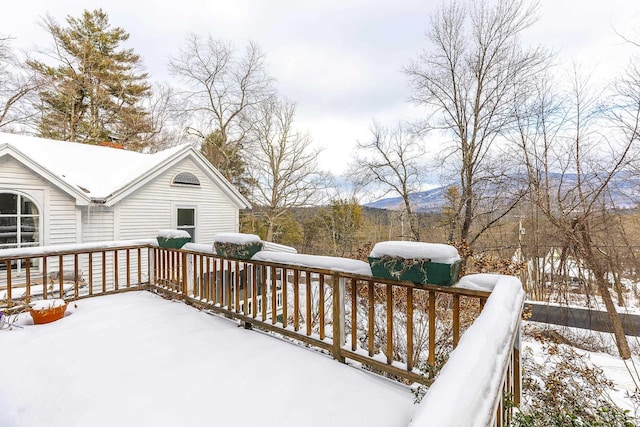 snow covered deck with grilling area