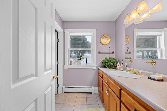 bathroom featuring a baseboard radiator, vanity, and tile patterned flooring