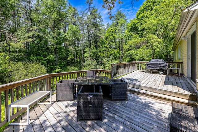 wooden deck featuring grilling area