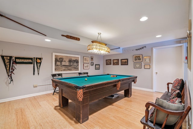 recreation room with pool table and light hardwood / wood-style flooring