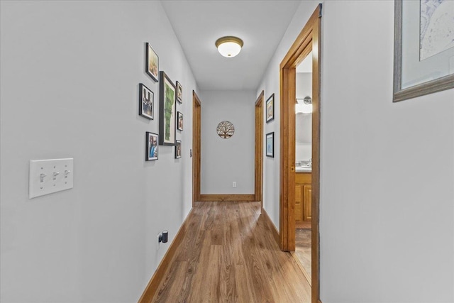 hall with light hardwood / wood-style floors