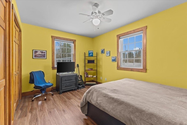 bedroom featuring ceiling fan and hardwood / wood-style floors