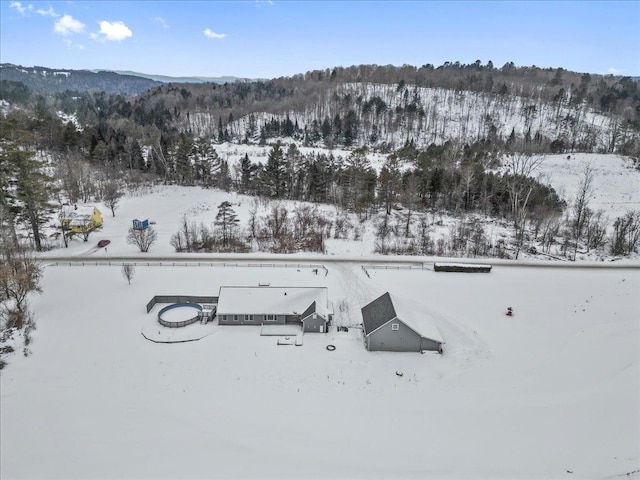 snowy aerial view with a mountain view