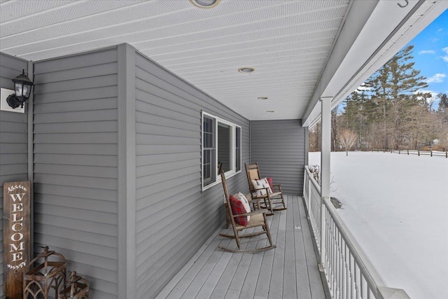 view of snow covered deck