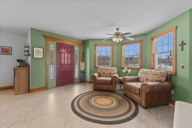 sitting room featuring ceiling fan