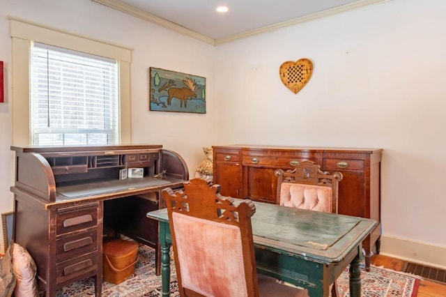 home office with hardwood / wood-style flooring and crown molding