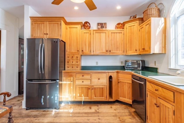 kitchen with ceiling fan, sink, stainless steel appliances, and a healthy amount of sunlight