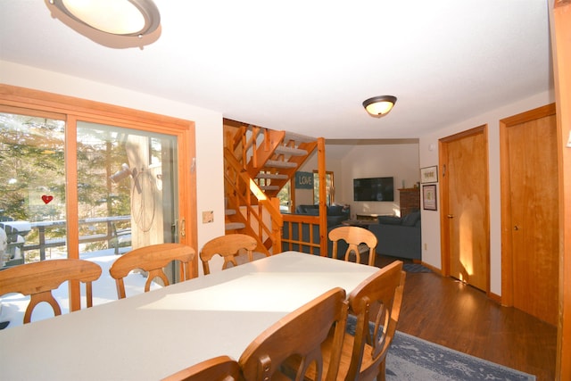 dining room featuring plenty of natural light and dark hardwood / wood-style floors