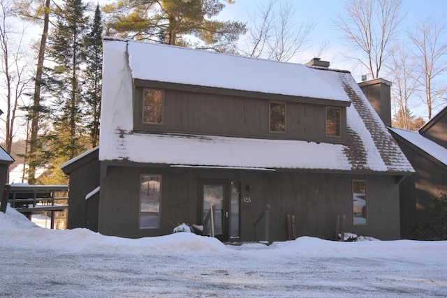 view of snow covered house