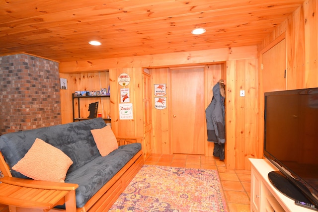 living room with wood ceiling and wood walls