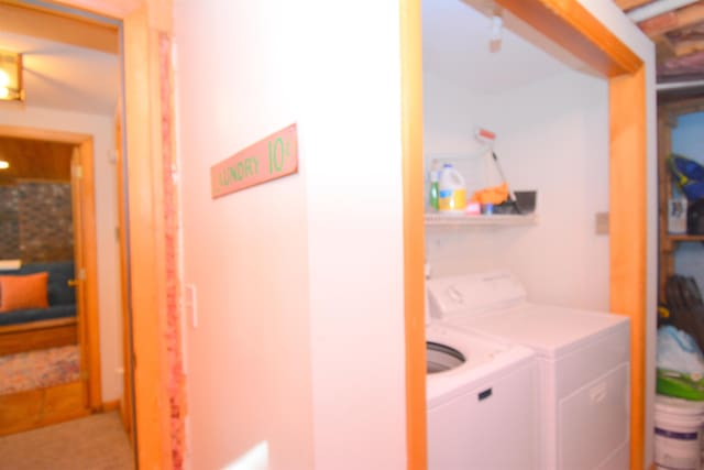 clothes washing area with independent washer and dryer