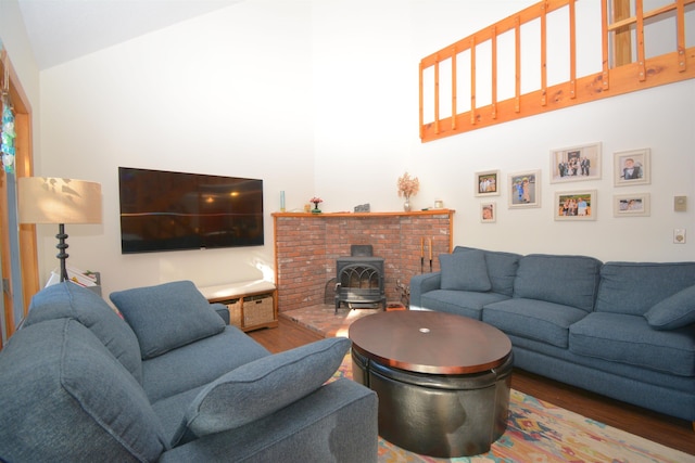 living room with wood-type flooring and a wood stove